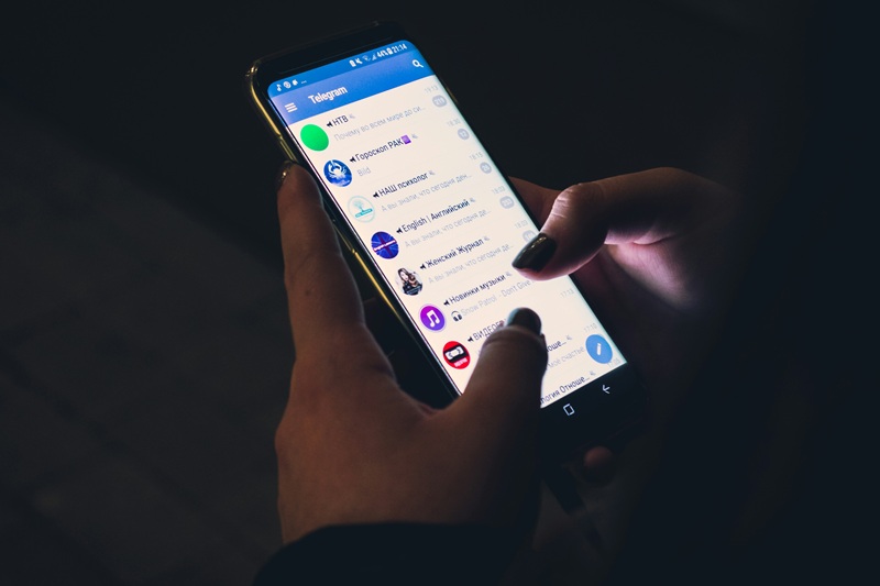 Smartphone screen displaying automated SMS maintenance appointment confirmation reminders.